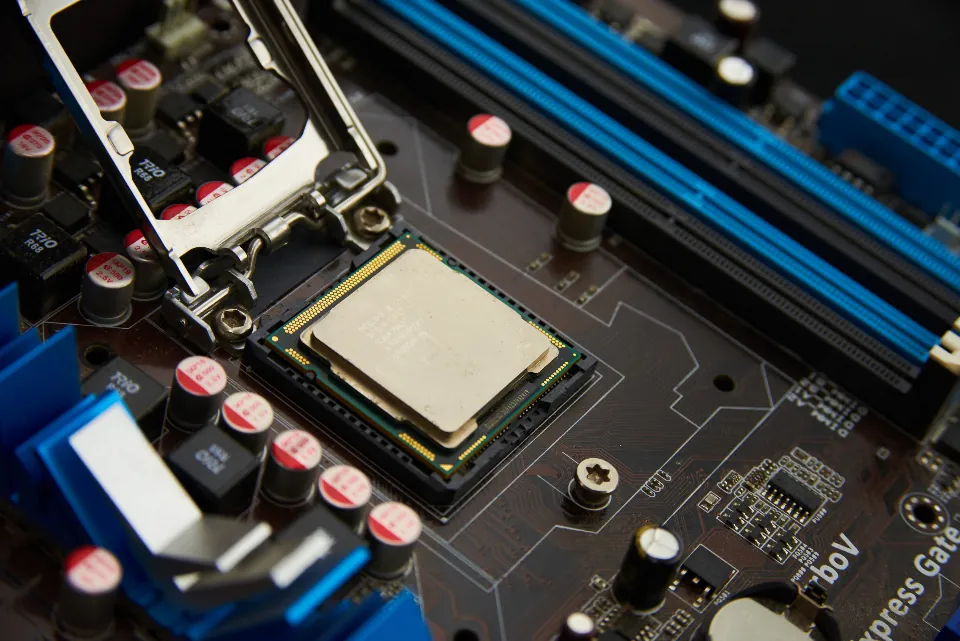 Close-up of a blue motherboard and processor